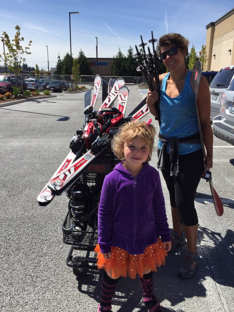 Picture of mother and daughter buying skis